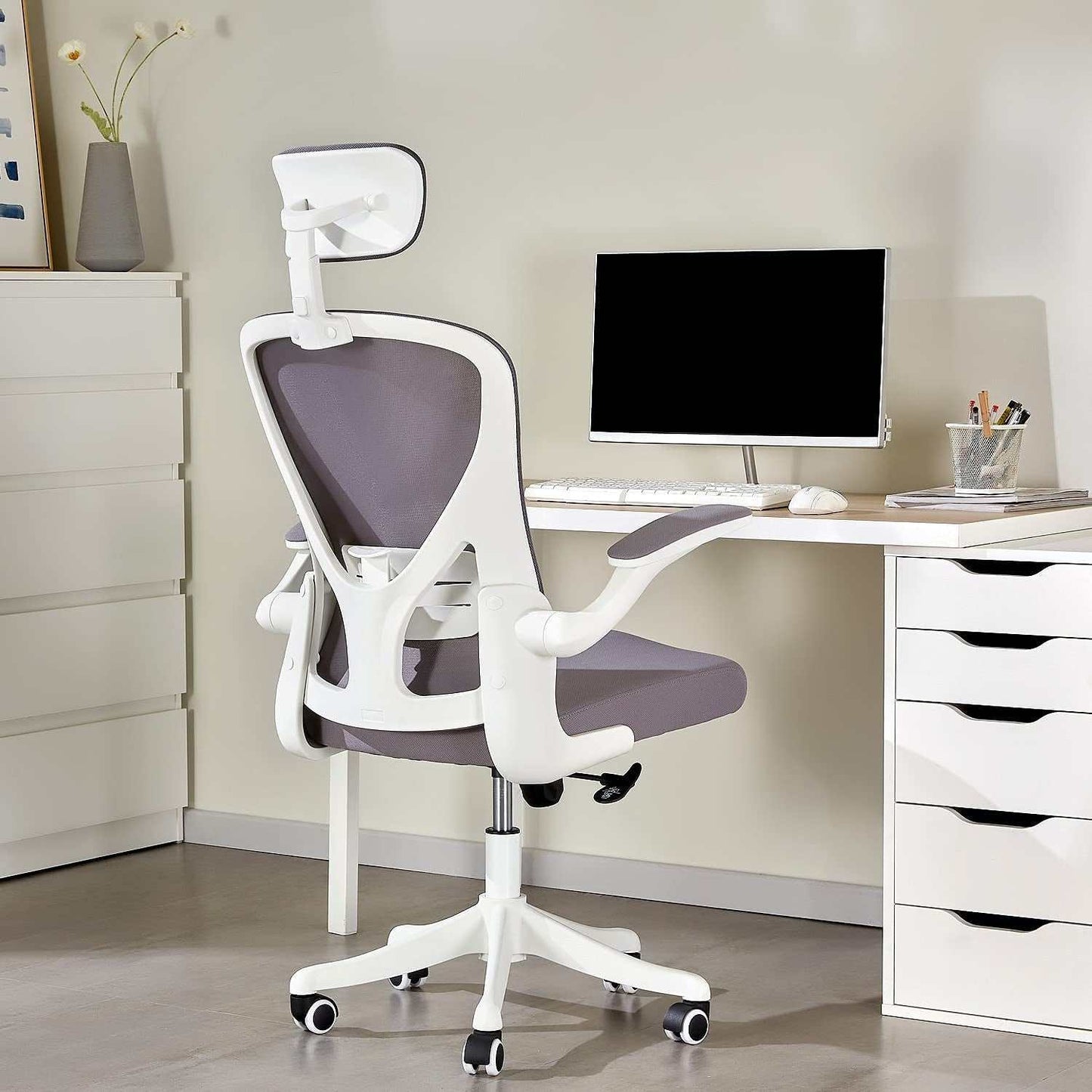 Dedeo ergonomic office chair with high back mesh, adjustable lumbar support, headrest, and thick seat cushion in a modern home office setting