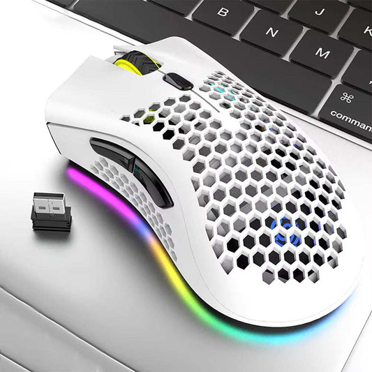White BM600 wireless gaming mouse with honeycomb design, RGB lighting, and USB receiver next to laptop keyboard